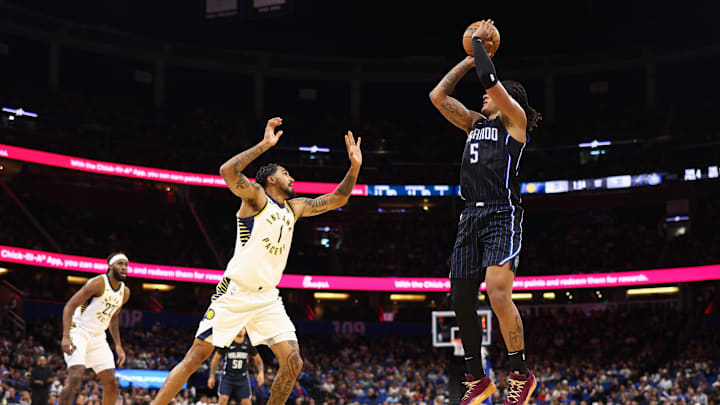 Orlando Magic forward Paolo Banchero (5) shoots the ball over Indiana Pacers forward Obi Toppin (1) in the first quarter at Kia Center.