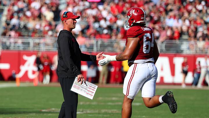 Nov 22, 2025; Tuscaloosa, Alabama, USA; Alabama Crimson Tide head coach Kalen DeBoer high fives Alabama Crimson Tide offensive lineman Michael Carroll (64) during the first half against the Eastern Illinois Panthers at Saban Field at Bryant-Denny Stadium. Mandatory Credit: David Leong-Imagn Images Nov 22, 2025; Tuscaloosa, Alabama, USA; Alabama Crimson Tide head coach Kalen DeBoer high fives Alabama Crimson Tide offensive lineman Michael Carroll (64) during the first half against the Eastern Illinois Panthers at Saban Field at Bryant-Denny Stadium. Mandatory Credit: David Leong-Imagn Images
