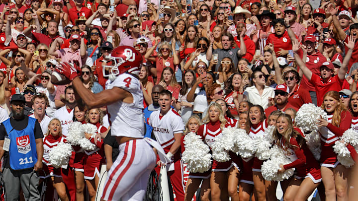 Fans watch as Sooners wide receiver Nic Anderson (4) catches a touchdown in the final seconds of the Red River Rivalry between the Oklahoma Sooners and the Texas Longhorns at the Cotton Bowl in Dallas, Saturday, Oct. 7, 2023. Oklahoma won 34-30.