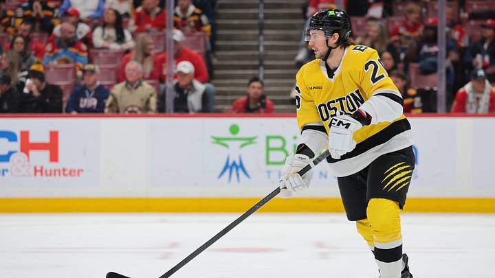 Feb 4, 2026; Sunrise, Florida, USA; Boston Bruins defenseman Andrew Peeke (26) moves the puck against the Florida Panthers during the first period at Amerant Bank Arena. Mandatory Credit: Sam Navarro-Imagn Images Feb 4, 2026; Sunrise, Florida, USA; Boston Bruins defenseman Andrew Peeke (26) moves the puck against the Florida Panthers during the first period at Amerant Bank Arena. Mandatory Credit: Sam Navarro-Imagn Images