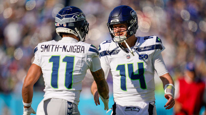 Seattle Seahawks wide receiver Jaxon Smith-Njigba (11) celebrates his touchdown with quarterback Sam Darnold (14) during the second quarter against the Tennessee Titans at Nissan Stadium in Nashville, Tenn., Sunday, Nov. 23, 2025.