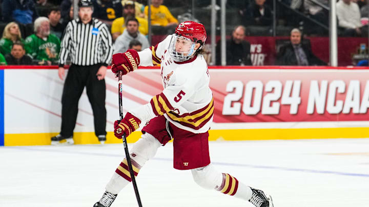 Apr 11, 2024; Saint Paul, Minnesota, USA; Boston College Eagles defenseman Drew Fortescue (5) shoots in the semifinals of the 2024 Frozen Four college ice hockey tournament during the second period against the Michigan Wolverines at Xcel Energy Center. Mandatory Credit: Brace Hemmelgarn-Imagn Images