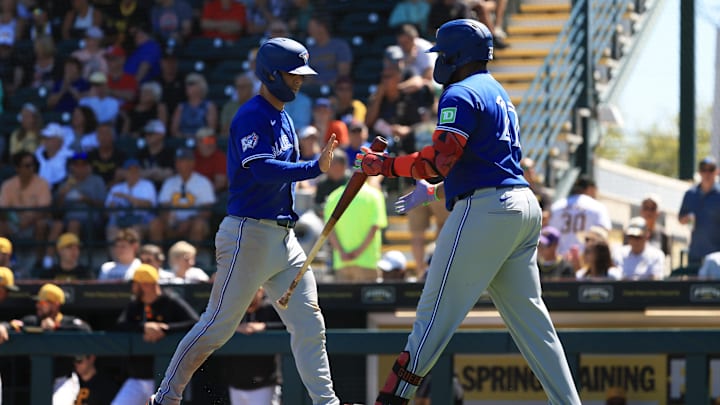 Toronto Blue Jays shortstop Andres Gimenez is congratulated by Vladimir Guerrero Jr. 
