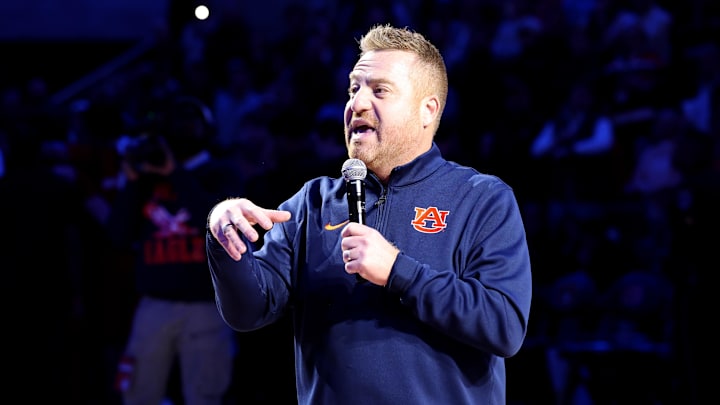 Dec 3, 2025; Auburn, Alabama, USA; Auburn Tigers head football coach Alex Golesh is introduced during the first half of a basketball game between the Auburn Tigers and NC State Wolfpack at Neville Arena. Mandatory Credit: John Reed-Imagn Images Dec 3, 2025; Auburn, Alabama, USA; Auburn Tigers head football coach Alex Golesh is introduced during the first half of a basketball game between the Auburn Tigers and NC State Wolfpack at Neville Arena. Mandatory Credit: John Reed-Imagn Images