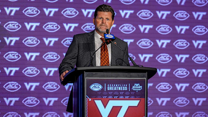 Jul 23, 2024; Charlotte, NC, USA; Virginia Tech head coach Brent Pry answers questions from the media during the ACC Kickoff at Hilton Charlotte Uptown. Mandatory Credit: Jim Dedmon-Imagn Images
