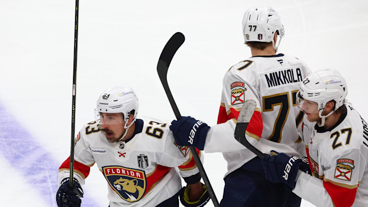 Jun 14, 2025; Edmonton, Alberta, CAN; Florida Panthers forward Brad Marchand (63) celebrates scoring during the third period with defenseman Niko Mikkola (77) and forward Eetu Luostarinen (27) against the Edmonton Oilers in game five of the 2025 Stanley Cup Final at Rogers Place. 