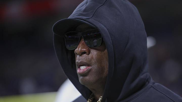 Dec 28, 2024; San Antonio, TX, USA; Colorado Buffaloes head coach Deion Sanders jogs on the field before the game against the Brigham Young Cougars at Alamodome. 