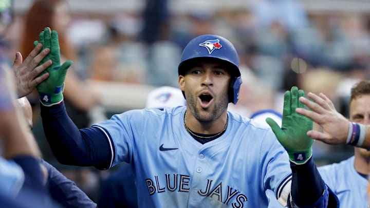 Jul 26, 2025; Detroit, Michigan, USA; Toronto Blue Jays outfielder George Springer (4) receives congratulations from teammates after he hits a home run in the ninth inning against the Detroit Tigers at Comerica Park. Jul 26, 2025; Detroit, Michigan, USA; Toronto Blue Jays outfielder George Springer (4) receives congratulations from teammates after he hits a home run in the ninth inning against the Detroit Tigers at Comerica Park.