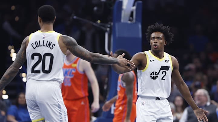 Dec 3, 2024; Oklahoma City, Oklahoma, USA; Utah Jazz guard Collin Sexton (2) and forward John Collins (20) high five after a play against the Oklahoma City Thunder during the first quarter of an NBA Cup game at Paycom Center. Mandatory Credit: Alonzo Adams-Imagn Images