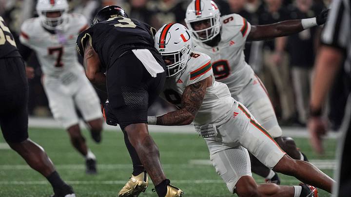 Sep 18, 2026; Winston-Salem, North Carolina, USA;  Miami (FL) Hurricanes defensive lineman Marquise Lightfoot (8) tackles Wake Forest Demon Deacons quarterback Gio Lopez (3) during the first half at Allegacy Federal Credit Union Stadium.  Mandatory Credit: Jim Dedmon-Imagn Images