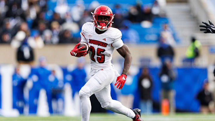 Nov 30, 2024; Lexington, Kentucky, USA; Louisville Cardinals running back Isaac Brown (25) runs the ball during the third quarter against the Kentucky Wildcats at Kroger Field. Mandatory Credit: Jordan Prather-Imagn Images