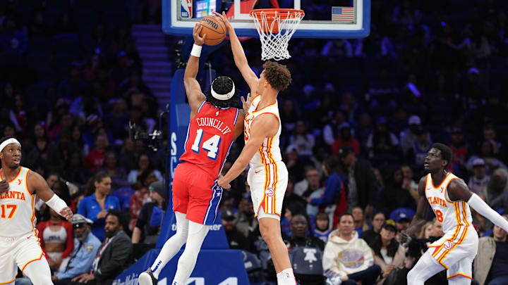 Apr 11, 2025; Philadelphia, Pennsylvania, USA; Atlanta Hawks guard Dyson Daniels (5) blocks a shot from Philadelphia 76ers guard Ricky Council IV (14) in the first quarter at Wells Fargo Center. Mandatory Credit: Kyle Ross-Imagn Images