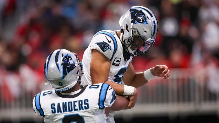 Jan 5, 2025; Atlanta, Georgia, USA; Carolina Panthers quarterback Bryce Young (9) celebrates with tight end Ja'Tavion Sanders (0) after a touchdown run against the Atlanta Falcons in the second quarter at Mercedes-Benz Stadium. Mandatory Credit: Brett Davis-Imagn Images