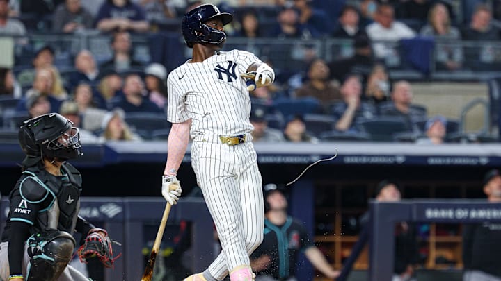 Apr 3, 2025; Bronx, New York, USA; New York Yankees third baseman Jazz Chisholm Jr. (13) breaks his chain during a swing during the sixth inning against the Arizona Diamondbacks at Yankee Stadium. Mandatory Credit: Vincent Carchietta-Imagn Images