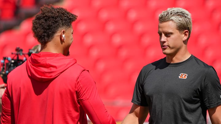 Sep 15, 2024; Kansas City, Missouri, USA; Kansas City Chiefs quarterback Patrick Mahomes (15) shakes hands with Cincinnati Bengals quarterback Joe Burrow (9) prior to a game at GEHA Field at Arrowhead Stadium. Mandatory Credit: Denny Medley-Imagn Images