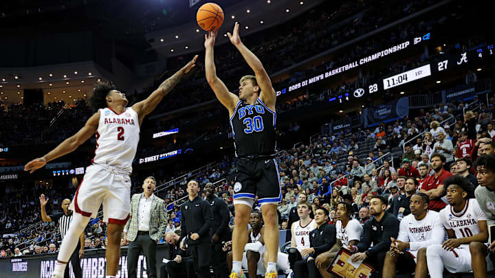 Mar 27, 2025; Newark, NJ, USA; Brigham Young Cougars guard Dallin Hall (30) shoots the ball against Alabama Crimson Tide guard Aden Holloway (2) during the first half during an East Regional semifinal of the 2025 NCAA tournament at Prudential Center. Mandatory Credit: Vincent Carchietta-Imagn Images