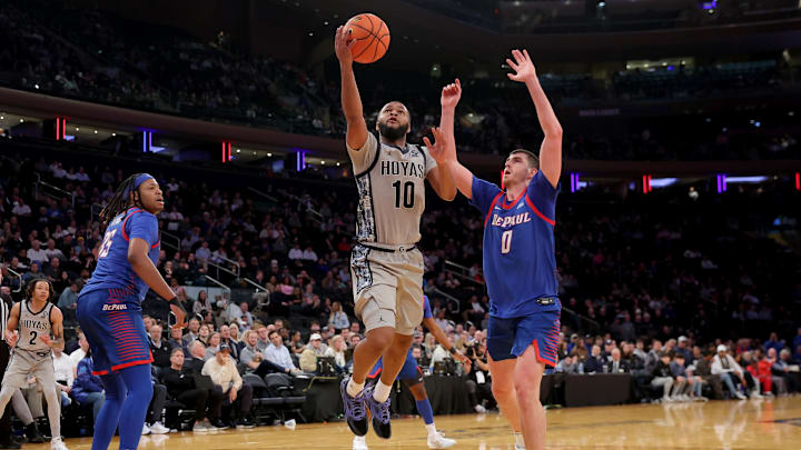 Mar 12, 2025; New York, NY, USA; Georgetown Hoyas guard Jayden Epps (10) drives to the basket against DePaul Blue Demons forwards Troy D'Amico (0) and NJ Benson (35) during the second half at Madison Square Garden. Mandatory Credit: Brad Penner-Imagn Images