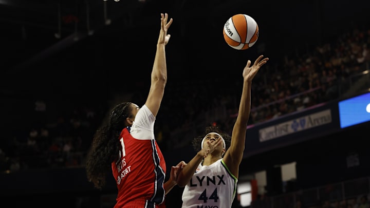 Apr 25, 2026; Washington, DC, USA; Minnesota Lynx guard-forward Aubrey Griffin (44) shoots the ball as Washington Mystics center Lauren Betts (51) defends in the second half at Entertainment & Sports Arena. Mandatory Credit: Geoff Burke-Imagn Images