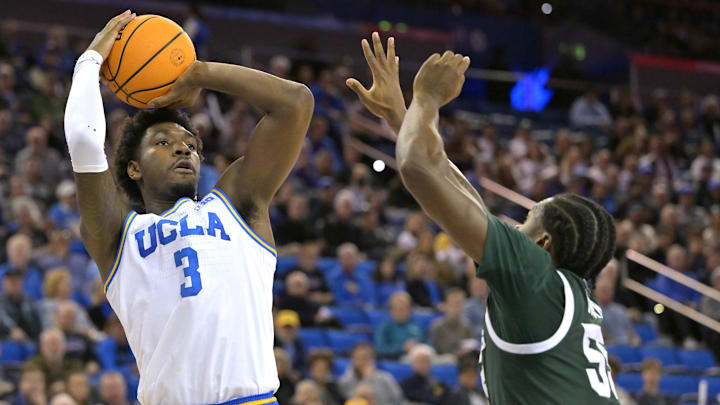 Feb 4, 2025; Los Angeles, California, USA; UCLA Bruins guard Eric Dailey Jr. (3) shoots over Michigan State Spartans forward Coen Carr (55) in the first half at Pauley Pavilion presented by Wescom. Mandatory Credit: Jayne Kamin-Oncea-Imagn Images