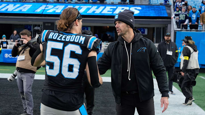 Dec 28, 2025; Charlotte, North Carolina, USA; Carolina Panthers head coach Dave Canales thanks linebacker Christian Rozeboom (56) during the second half at Bank of America Stadium. Mandatory Credit: Jim Dedmon-Imagn Images