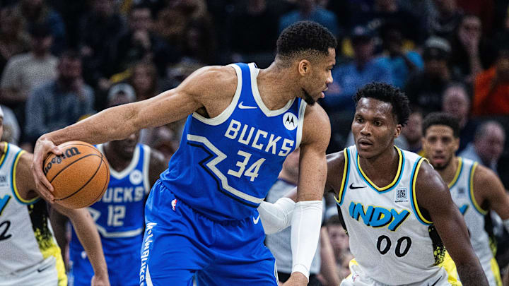 Mar 11, 2025; Indianapolis, Indiana, USA; Milwaukee Bucks forward Giannis Antetokounmpo (34) dribbles the ball while Indiana Pacers guard Bennedict Mathurin (00) defends in the first half at Gainbridge Fieldhouse. Mandatory Credit: Trevor Ruszkowski-Imagn Images Mar 11, 2025; Indianapolis, Indiana, USA; Milwaukee Bucks forward Giannis Antetokounmpo (34) dribbles the ball while Indiana Pacers guard Bennedict Mathurin (00) defends in the first half at Gainbridge Fieldhouse. Mandatory Credit: Trevor Ruszkowski-Imagn Images