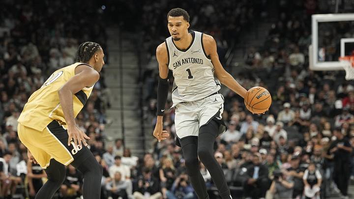 Dec 18, 2025; San Antonio, Texas, USA; San Antonio Spurs forward Victor Wembanyama (1) dribbles against Washington Wizards forward Alex Sarr (20) during the first half at Frost Bank Center. Mandatory Credit: Scott Wachter-Imagn Images Dec 18, 2025; San Antonio, Texas, USA; San Antonio Spurs forward Victor Wembanyama (1) dribbles against Washington Wizards forward Alex Sarr (20) during the first half at Frost Bank Center. Mandatory Credit: Scott Wachter-Imagn Images