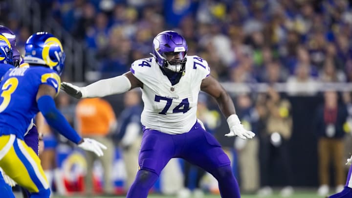 Jan 13, 2025; Glendale, AZ, USA; Minnesota Vikings tackle Cam Robinson (74) against the Los Angeles Rams during an NFC wild card game at State Farm Stadium. Mandatory Credit: Mark J. Rebilas-Imagn Images