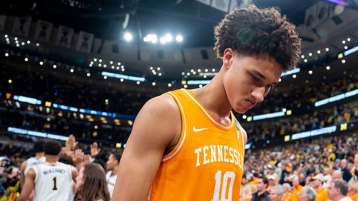 Tennessee forward Nate Ament (10) walks off the court as Michigan players celebrate their Final Four berth behind him after a NCAA Tournament Elite 8 game between Tennessee and Michigan at the United Center in Chicago on March 29, 2026.