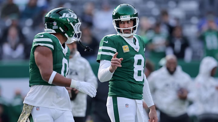 Nov 17, 2024; East Rutherford, New Jersey, USA; New York Jets quarterback Aaron Rodgers (8) and running back Braelon Allen (0) warm up before a game against the Indianapolis Colts at MetLife Stadium. Mandatory Credit: Brad Penner-Imagn Images