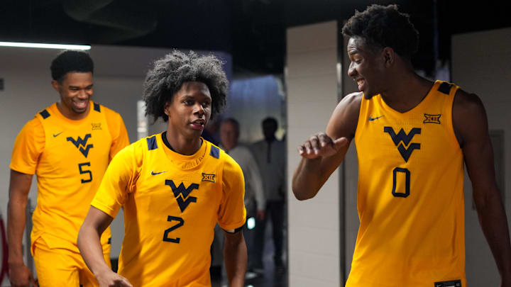 Feb 5, 2026; Cincinnati, Ohio, USA; West Virginia Mountaineers guard Amir Jenkins (2) and forward Brenen Lorient (0) celebrate after their team’s win against the Cincinnati Bearcats at Fifth Third Arena. Mandatory Credit: Aaron Doster-Imagn Images