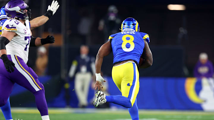 Jan 13, 2025; Glendale, AZ, USA; Los Angeles Rams linebacker Jared Verse (8) recovers a fumble against the Minnesota Vikings during the first half in an NFC wild card game at State Farm Stadium. Mandatory Credit: Mark J. Rebilas-Imagn Images