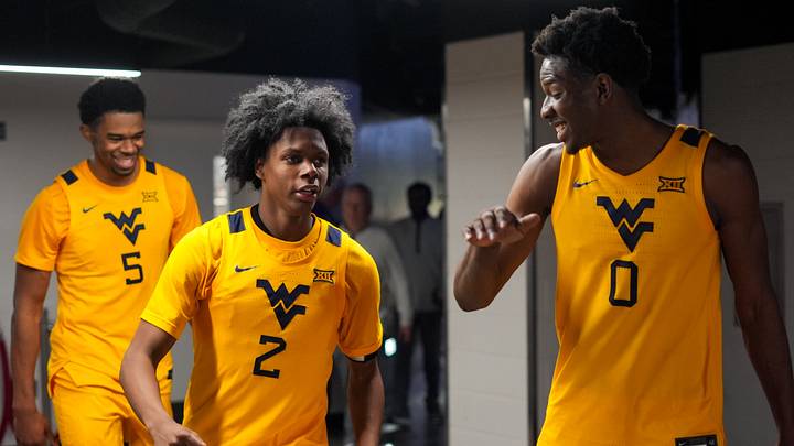 Feb 5, 2026; Cincinnati, Ohio, USA; West Virginia Mountaineers guard Amir Jenkins (2) and forward Brenen Lorient (0) celebrate after their team’s win against the Cincinnati Bearcats at Fifth Third Arena. Mandatory Credit: Aaron Doster-Imagn Images