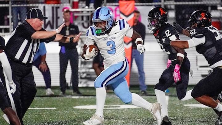 MJ Gideon runs the ball for James Clemens High School MJ Gideon runs the ball for James Clemens High School