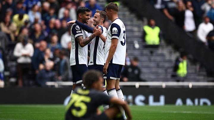 Romero, Maddison, and Van de Ven celebrate Romero's goal against Everton