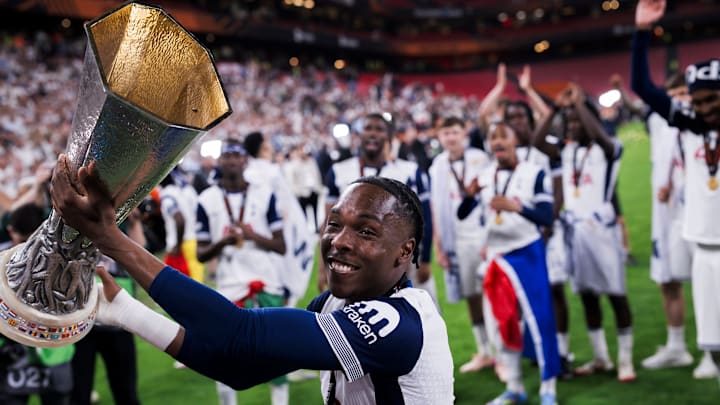 Mathys Tel of Tottenham Hotspur FC lifts the trophy during... Mathys Tel of Tottenham Hotspur FC lifts the trophy during...