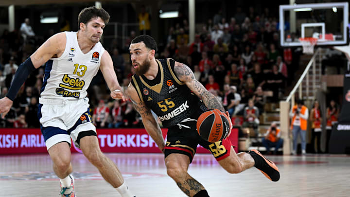 Monaco player #55 Mike James and Fenerbahce player #13 Tarik...