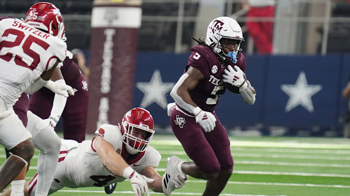 Texas A&M Aggies running back Amari Daniels #5 rushes with...