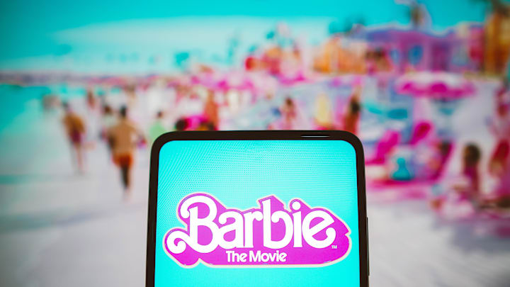 In this photo illustration, the Barbie the movie logo seen...