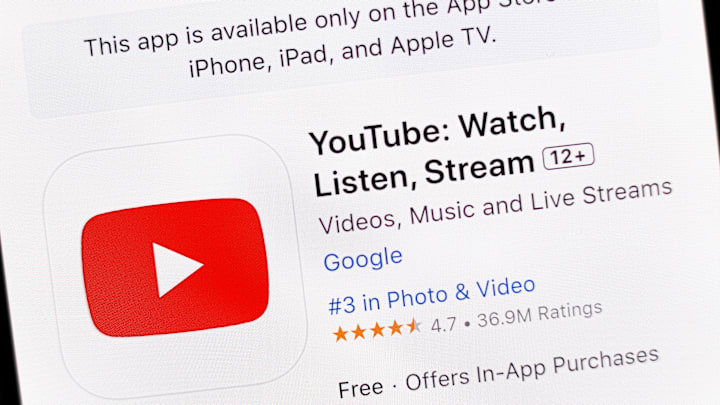 In this photo illustration, the YouTube app is seen on the...