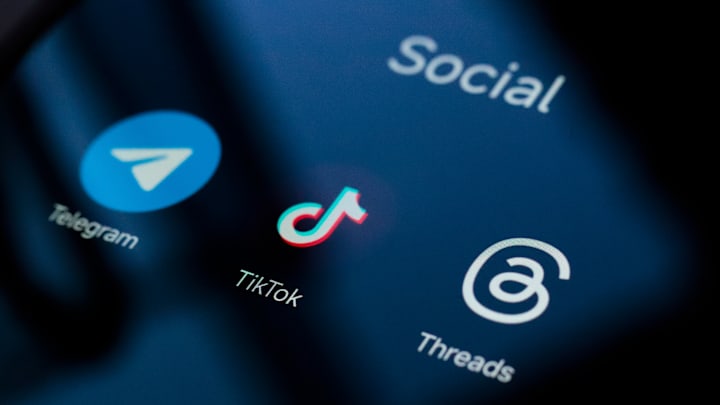 In this photo illustration, Telegram, TikTok and Threads...