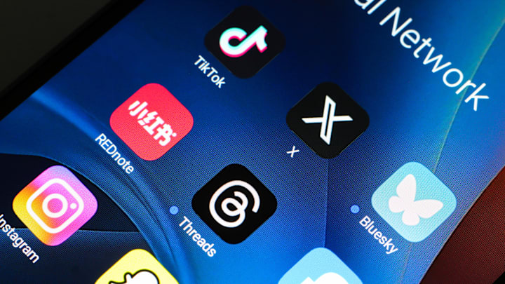 In this photo illustration, the TikTok, Xiaohongshu (Rednote...
