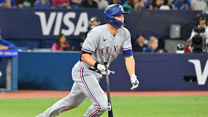 Sep 12, 2023; Toronto, Ontario, CAN;  Texas Rangers shortstop Corey Seager (5) hits an RBI double