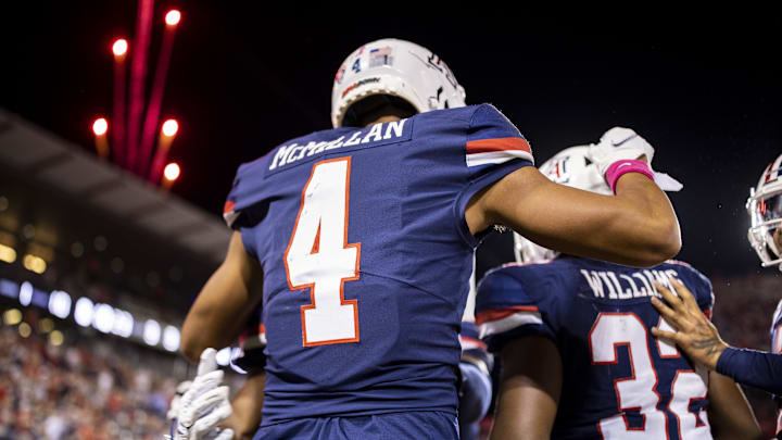 Oct 1, 2022; Tucson, Arizona, USA; Arizona Wildcats wide receiver Tetairoa McMillan (4) celebrates after catching a touchdown pass against the Colorado Buffaloes in the first half at Arizona Stadium. Mandatory Credit: Ivan Pierre Aguirre-USA TODAY Sports