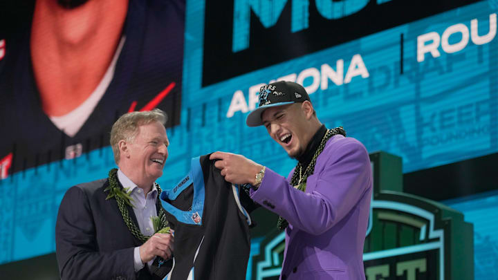 NFL Commissioner Rodger Goodell, left, with Arizona Wildcats wide receiver Tetairoa McMillan selected by the Carolina Panthers as the number eight pick in the first round of the 2025 NFL Draft at Lambeau Field.