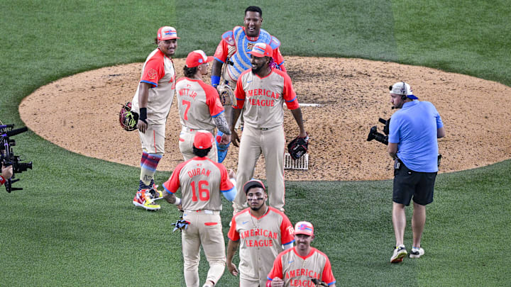 Jul 16, 2024; Arlington, Texas, USA; The American League players celebrate after the they defeat the National League in the 2024 MLB All-Star game at Globe Life Field. Mandatory Credit: Jerome Miron-Imagn Images
