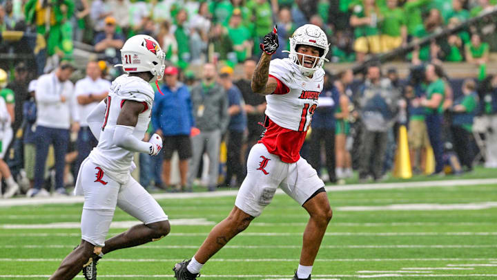Sep 28, 2024; South Bend, Indiana, USA; Louisville Cardinals safety Tamarion McDonald (12) reacts after recovering a fumbled kickoff against the Notre Dame Fighting Irish in the first quarter at Notre Dame Stadium. Mandatory Credit: Matt Cashore-Imagn Images