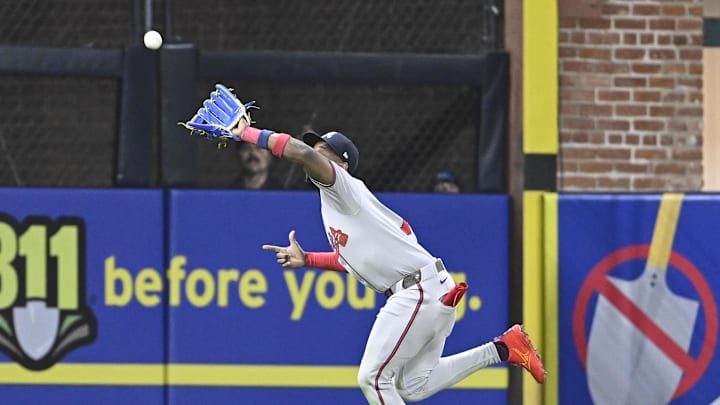 Mar 28, 2025; San Diego, California, USA; Atlanta Braves left fielder Jurickson Profar (7) makes a catch on a ball hit by San Diego Padres center fielder Jackson Merrill (not picture) during seventh inning at Petco Park. Mandatory Credit: Denis Poroy-Imagn Images