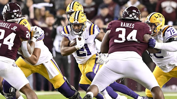 Nov 26, 2022; College Station, Texas, USA;  LSU Tigers running back Noah Cain (21) carries the ball