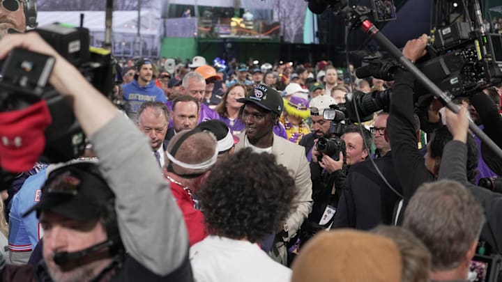 Quarterback Cam Ward from Miami walks through a crowd after being selected 1st overall by the Tennessee Titans during the first round of the 2025 NFL Draft at Lambeau Field on April 24, 2025 in Green Bay, Wisconsin.