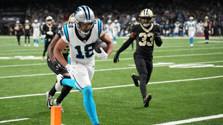 Dec 14, 2025; New Orleans, Louisiana, USA; Carolina Panthers wide receiver Jalen Coker (18) scores a touchdown in the third quarter against the New Orleans Saints at Caesars Superdome. Mandatory Credit: Matthew Hinton-Imagn Images Dec 14, 2025; New Orleans, Louisiana, USA; Carolina Panthers wide receiver Jalen Coker (18) scores a touchdown in the third quarter against the New Orleans Saints at Caesars Superdome. Mandatory Credit: Matthew Hinton-Imagn Images
